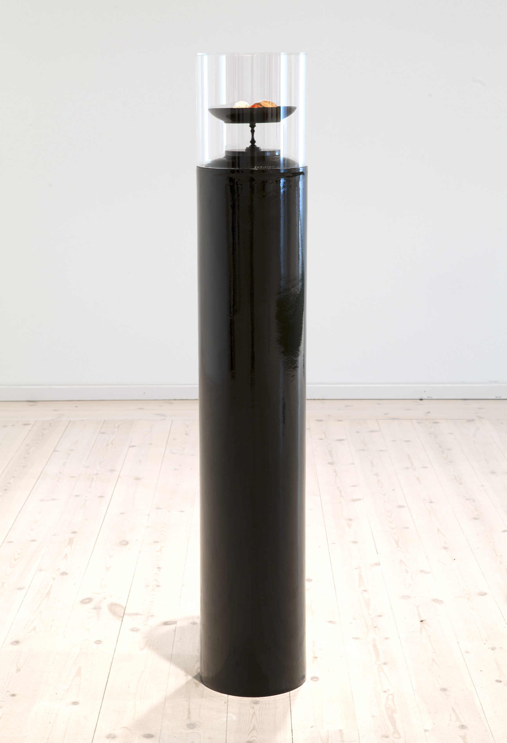 Jakob Westberg, "Sweet me", 2016. Pralines with content of the artists own fat, plexiglass, concrete form tube, porcelain ,wood, brass, mdf, industrial filler + paint. 120 x 20 x20 cm